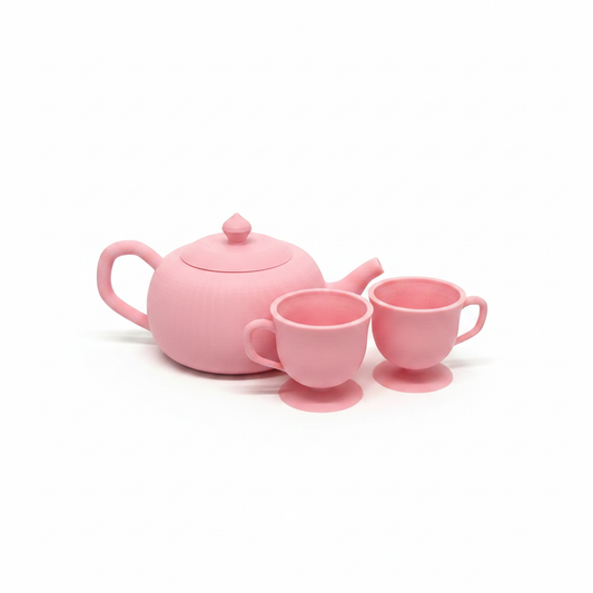3D printed pastel pink tea set toy on white background