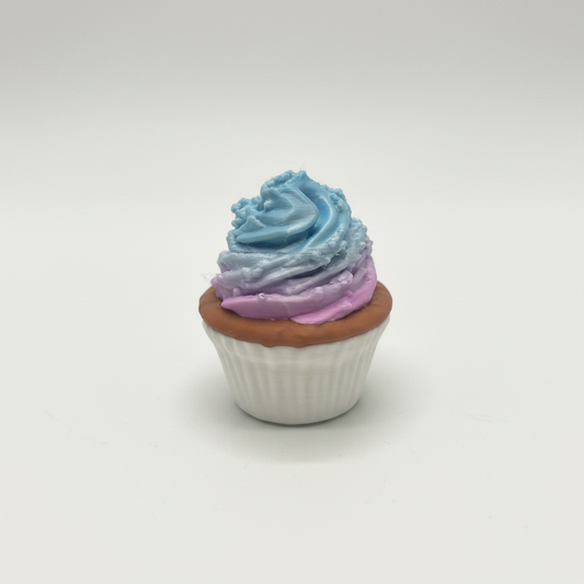 3D printed pink and blue ombre cupcake toy on white background